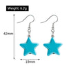 Turquoise star-shaped earrings with measurements and weight displayed on a white background