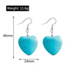 Turquoise heart-shaped earrings with measurements and weight on a white background
