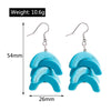 Turquoise earrings with measurements and weight on a white background