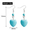 Turquoise heart-shaped earrings with measurements and weight displayed on a white background