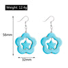 Blue star-shaped earrings with measurements and weight displayed on a white background