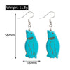 Turquoise penguin-shaped earrings with measurements and weight on a white background